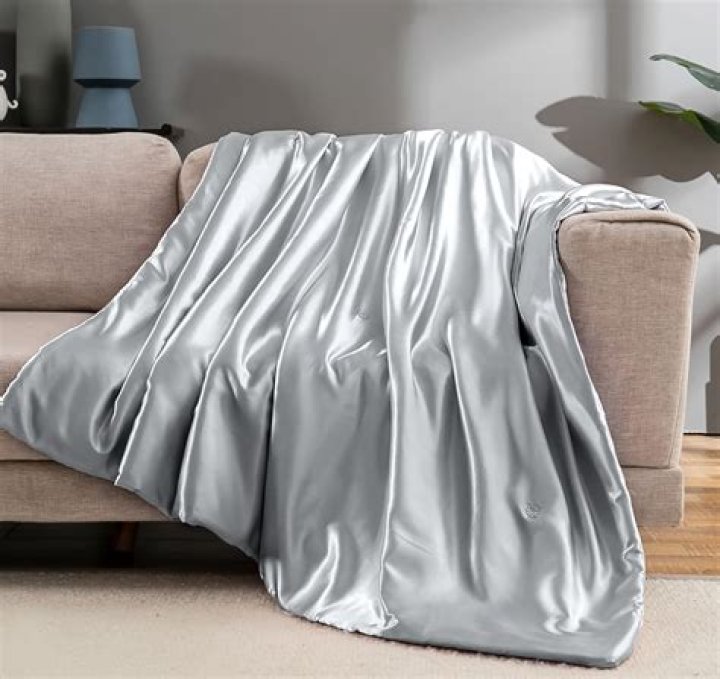 Chic And Cozy: Elevate Your Living Space With A Metallic Silver Throw Blanket
