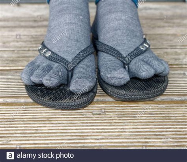 Essential Footwear Combo: Uncover The Stylish Versatility Of Black Socks And Flip Flops